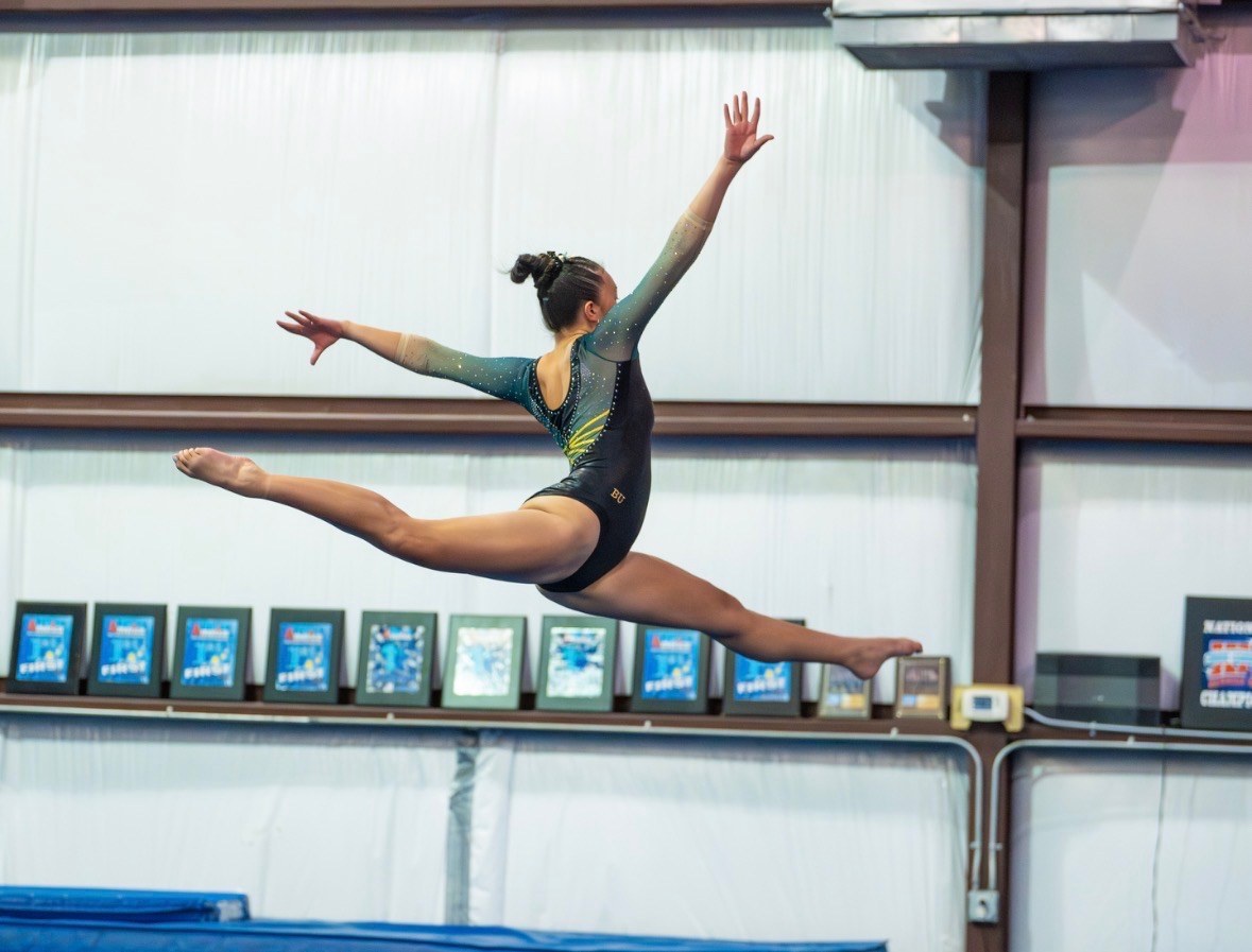 Emerson Budde performing a split leap