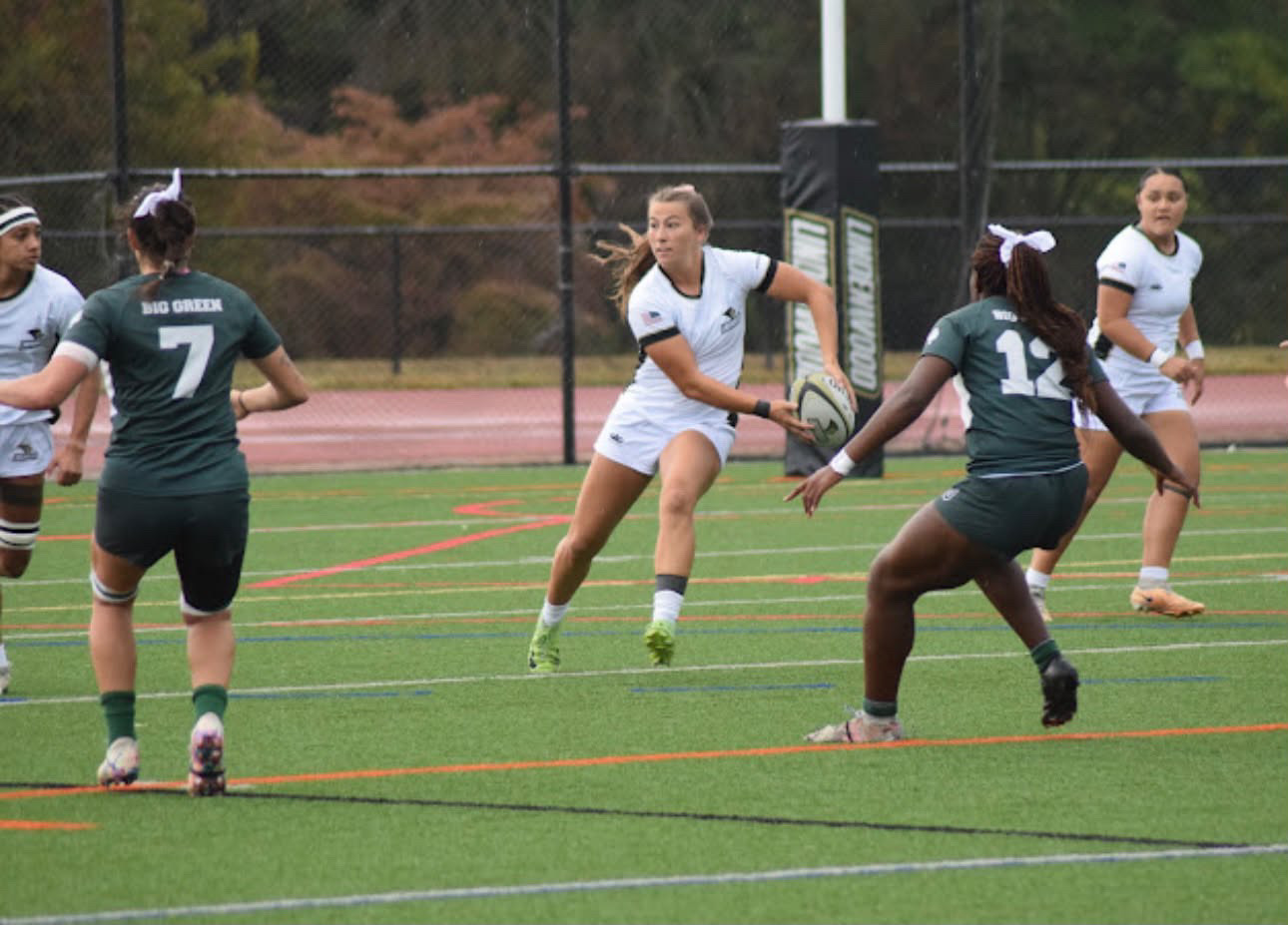 Makenna Bailey carrying the rugby ball during a Lindenwood game